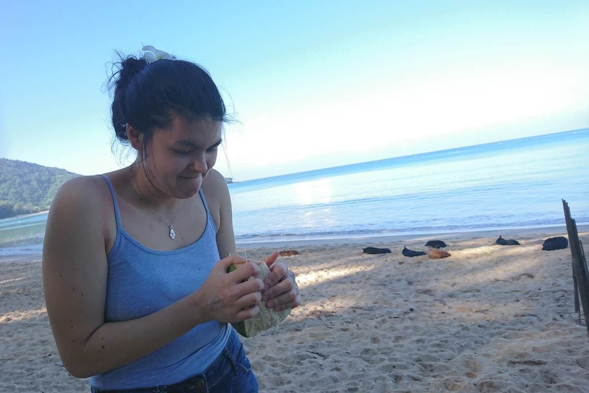 Jana fighting the coconut in Sirinat Phuket